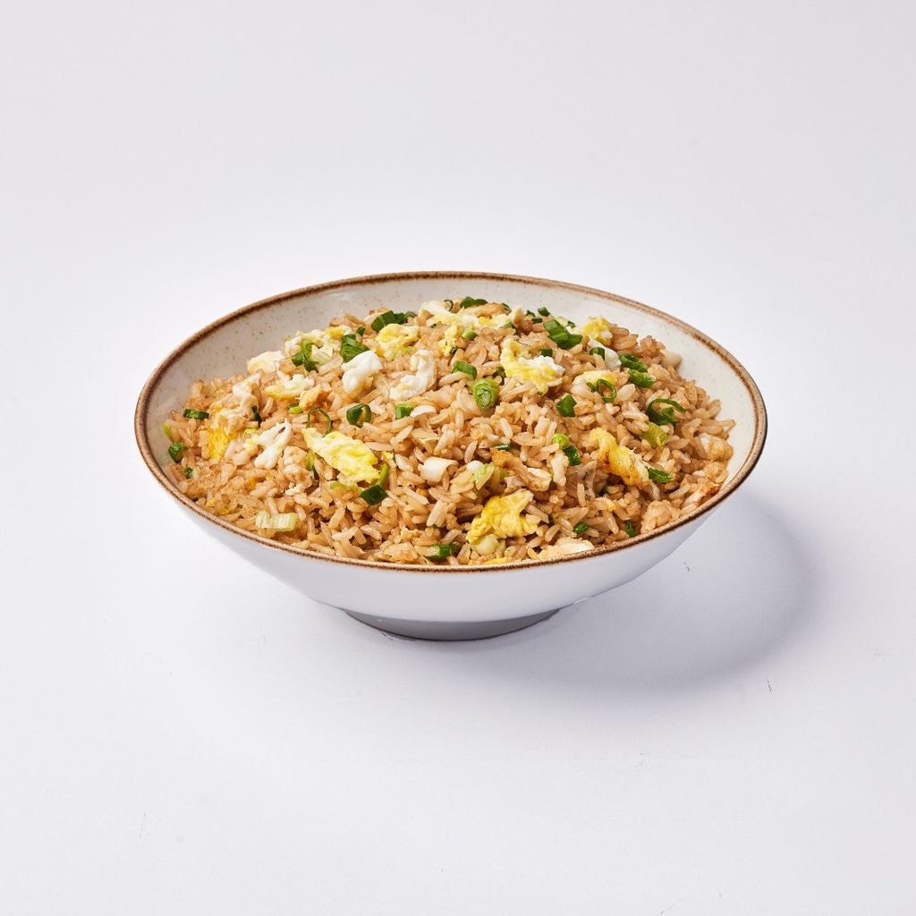 Porción de arroz chaufa Norkys incluye: arroz, cebolla china, sillao y huevo