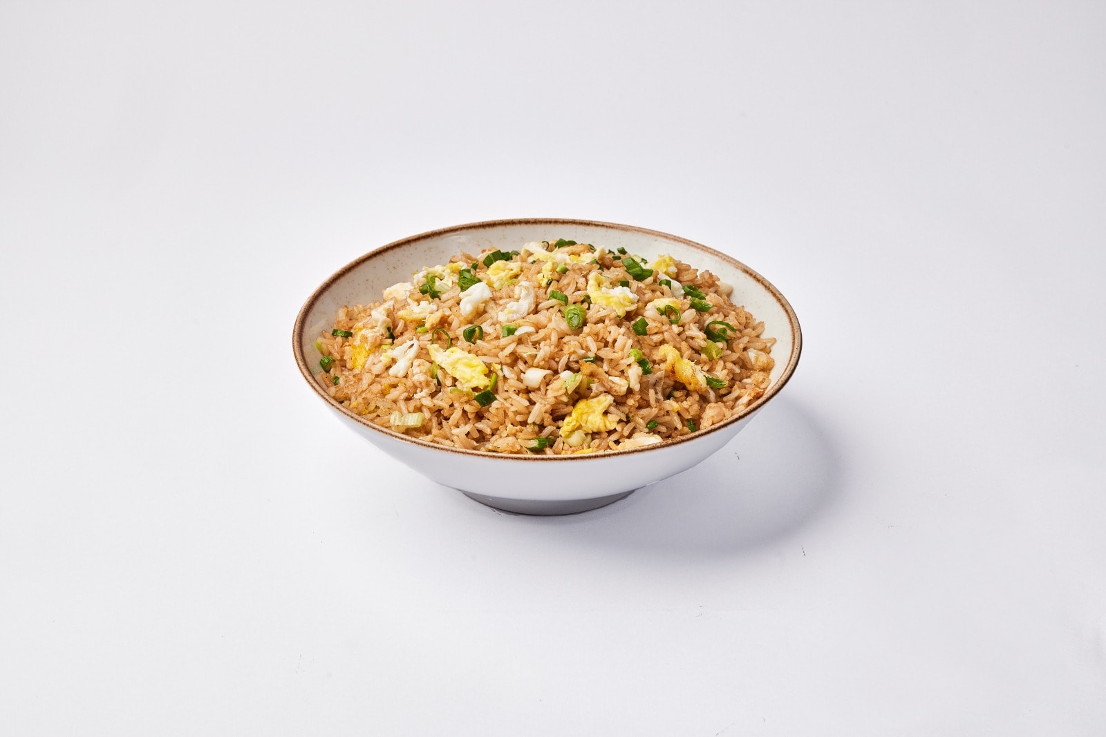 Porción de arroz chaufa Norkys incluye: arroz, cebolla china, sillao y huevo